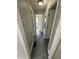 Hallway showing gray vinyl floors and white doors at 3730 Clovis Nw Ct, Atlanta, GA 30331