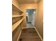 Hallway with new gray floors and access to extra storage space and the kitchen at 3730 Clovis Nw Ct, Atlanta, GA 30331