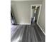 Hallway featuring gray wood-look flooring with multiple doors at 3730 Clovis Nw Ct, Atlanta, GA 30331