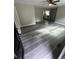 Open living space features stylish gray vinyl flooring and ceiling fan at 3730 Clovis Nw Ct, Atlanta, GA 30331