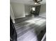 Open-concept living room featuring gray wood-look flooring at 3730 Clovis Nw Ct, Atlanta, GA 30331