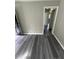 Open-concept living room features modern gray flooring and neutral paint at 3730 Clovis Nw Ct, Atlanta, GA 30331
