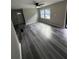 Bright and airy living room features luxury vinyl plank flooring and a ceiling fan at 3730 Clovis Nw Ct, Atlanta, GA 30331