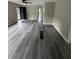 Living room featuring modern gray floors, fresh paint, and an open layout at 3730 Clovis Nw Ct, Atlanta, GA 30331