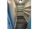 Small storage room with modern gray flooring and built-in shelving units at 3730 Clovis Nw Ct, Atlanta, GA 30331