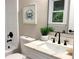 Elegant bathroom with a modern vanity, black faucet, and a tastefully decorated wall, creating a serene atmosphere at 4296 Langdon Dr, Decatur, GA 30035