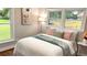Comfortable bedroom featuring a cozy bed, soft pillows, and bright natural light from the windows at 4296 Langdon Dr, Decatur, GA 30035