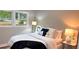 Inviting bedroom featuring soft lighting, comfortable bedding, and neutral decor at 4296 Langdon Dr, Decatur, GA 30035