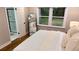 Cozy bedroom with a large window, neutral decor, and an ensuite bathroom at 4296 Langdon Dr, Decatur, GA 30035