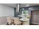 Modern kitchen island with marble countertops, a breakfast bar, and stainless steel appliances at 4296 Langdon Dr, Decatur, GA 30035