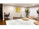 Spacious living room with modern decor, featuring a large island, desk, and stylish seating arrangements at 4296 Langdon Dr, Decatur, GA 30035