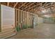 Unfinished basement with exposed ceiling, concrete flooring, and rough-in plumbing for future customization at 85 Presley Farm Pkwy, Rockmart, GA 30153