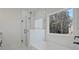 This bathroom is bright, with subway tile, a glass shower and a large soaking tub at 85 Presley Farm Pkwy, Rockmart, GA 30153