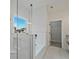 Bright bathroom featuring a soaking tub, walk-in shower with glass surround and modern fixtures at 85 Presley Farm Pkwy, Rockmart, GA 30153