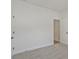 This bedroom offers neutral carpet, white walls, and two doors at 85 Presley Farm Pkwy, Rockmart, GA 30153