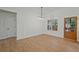 Dining room features clean lines, modern lighting, board and batten detail, wood floors, and ample natural light at 85 Presley Farm Pkwy, Rockmart, GA 30153