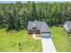 Charming home featuring a covered porch, an attached two-car garage, and a well-manicured front lawn at 85 Presley Farm Pkwy, Rockmart, GA 30153