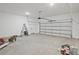 Spacious two-car garage with high ceilings, overhead lighting, and ample room for storage and work space at 85 Presley Farm Pkwy, Rockmart, GA 30153