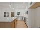 Modern kitchen with granite countertops, stainless steel appliances, and a functional center island at 85 Presley Farm Pkwy, Rockmart, GA 30153
