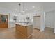 Well-appointed kitchen with a large island, granite countertops, stainless steel appliances, and wood floors at 85 Presley Farm Pkwy, Rockmart, GA 30153