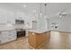 Modern kitchen with granite countertops, stainless steel appliances, island, and ample cabinet space at 85 Presley Farm Pkwy, Rockmart, GA 30153