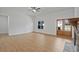 Expansive living area featuring hardwood floors, stone fireplace, and plenty of natural light at 85 Presley Farm Pkwy, Rockmart, GA 30153