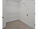 Spacious walk-in closet featuring carpet flooring, wire shelving, and a convenient layout at 85 Presley Farm Pkwy, Rockmart, GA 30153