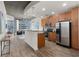 Contemporary kitchen showcasing stainless steel appliances, and a breakfast bar at 855 Peachtree Ne St # 1508, Atlanta, GA 30308