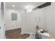 Compact office space featuring a sleek desk, decor, and wood-style flooring at 855 Peachtree Ne St # 1508, Atlanta, GA 30308