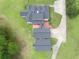 An elevated aerial view of the home's multi-section roof and brick patio design at 2759 Bay Ridge Dr, Loganville, GA 30052