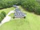 Aerial shot of the home with a long driveway and a sprawling green lawn at 2759 Bay Ridge Dr, Loganville, GA 30052