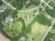 Scenic aerial view of homes nestled among lush green trees and landscaping at 2759 Bay Ridge Dr, Loganville, GA 30052