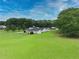 Aerial view of home with its meticulously landscaped grounds and many trees at 2759 Bay Ridge Dr, Loganville, GA 30052