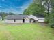 Aerial shot of the backyard featuring a garage, patio and grassy lawn at 2759 Bay Ridge Dr, Loganville, GA 30052