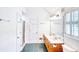 Bathroom featuring double sinks, a large mirror, a shower, and shuttered windows at 2759 Bay Ridge Dr, Loganville, GA 30052