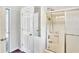 A view of a bathroom featuring a shower and doors at 2759 Bay Ridge Dr, Loganville, GA 30052