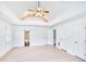 Bright bedroom with wood floors, a ceiling fan, and white walls with multiple closets and doorways at 2759 Bay Ridge Dr, Loganville, GA 30052