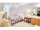 Cozy bedroom with sloped ceilings, complemented by a vintage floral quilt and soft carpeting at 2759 Bay Ridge Dr, Loganville, GA 30052
