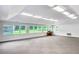 Bright, expansive bonus room with ample natural light and neutral carpeting, perfect for versatile use and enjoyment at 2759 Bay Ridge Dr, Loganville, GA 30052