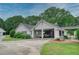 Sprawling property featuring a carport, garage, and lush lawn, providing ample space and parking, enhancing curb appeal at 2759 Bay Ridge Dr, Loganville, GA 30052