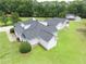 Detailed aerial view of home's exterior, manicured lawn, and pristine landscaping at 2759 Bay Ridge Dr, Loganville, GA 30052