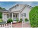 Charming home featuring white siding, a covered porch, and a lovely brick walkway, creating a welcoming curb appeal at 2759 Bay Ridge Dr, Loganville, GA 30052