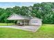 Lovely home featuring a covered parking area and a lush green lawn at 2759 Bay Ridge Dr, Loganville, GA 30052
