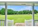 View from the porch to the large green front yard with mature trees at 2759 Bay Ridge Dr, Loganville, GA 30052