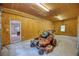 Garage with mower and view to office area at 2759 Bay Ridge Dr, Loganville, GA 30052