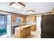 Bright kitchen featuring a center island, tile backsplash, and plenty of counter space at 2759 Bay Ridge Dr, Loganville, GA 30052