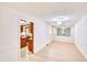 Bright room with wood floors, with a view into the kitchen and a large decorative mirror at 2759 Bay Ridge Dr, Loganville, GA 30052
