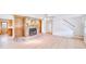 Open-concept living room with fireplace, built-in bookshelves, and hardwood floors at 2759 Bay Ridge Dr, Loganville, GA 30052