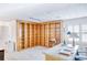 Home office with built-in wooden bookshelves, a large desk, and bright natural light at 2759 Bay Ridge Dr, Loganville, GA 30052