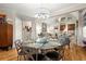Elegant dining room with a glass-top table and views of the living room at 2797 Middlecreek Way, Cumming, GA 30041